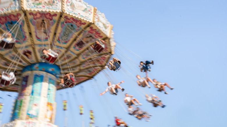 People on a carousel swing ride at the Tulsa State Fair in Oklahoma