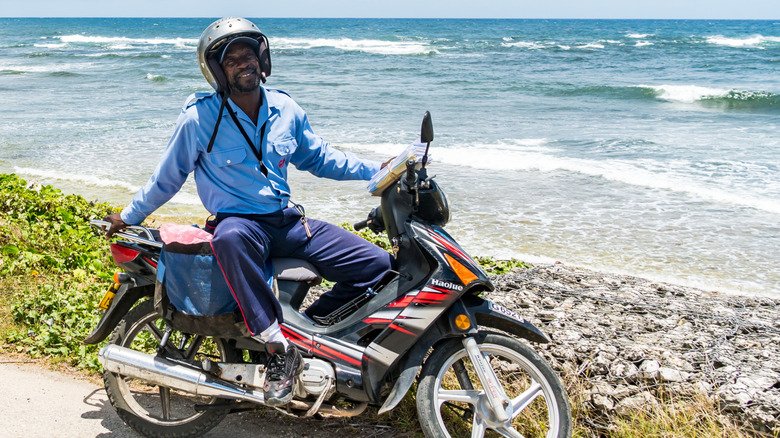 A man on motor bike during shoulder season in the Caribbean