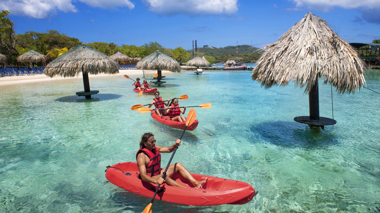 A family kayaking in the ocean