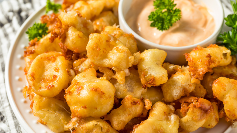 Homemade deep-fried Wisconsin cheese curds with dipping sauce
