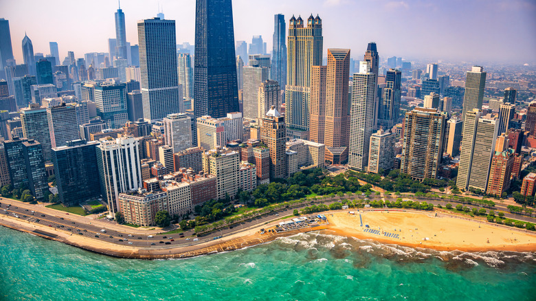 The skyline of downtown Chicago, Illinois beyond Oak Street Beach via helicopter