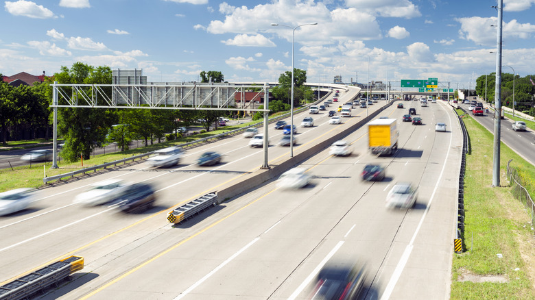 Cars in motion on a highway on a sunny day