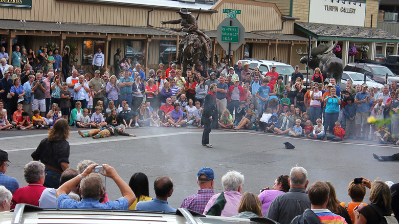 Visitors watching a shootout reenactment in Jackson