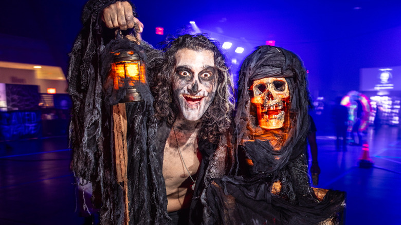 People in living dead costumes