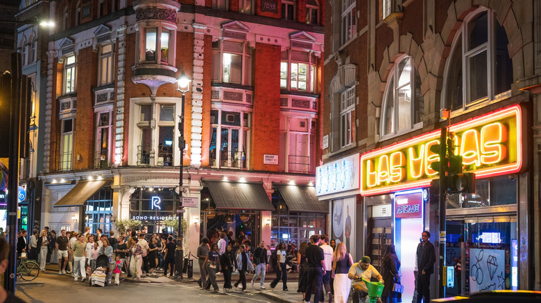 Londoners outside local bars in the London SoHo theatre district, in downtown London, at night