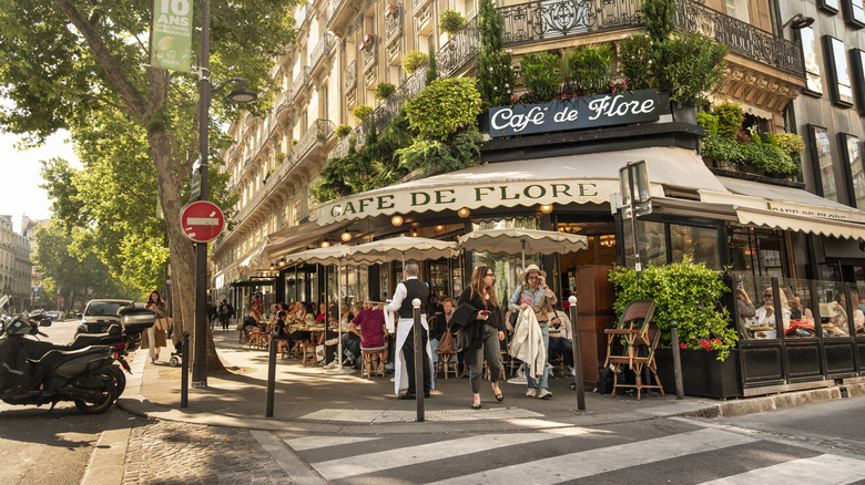 The famous Café de Flore with tables and chairs on an outdoor terrace in Saint-Germain-des-Prés, Paris