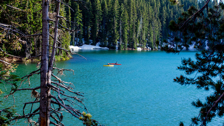 Two kayakers on Elk Lake in central Oregon, near Bend, along the Cascade Lakes Scenic Byway
