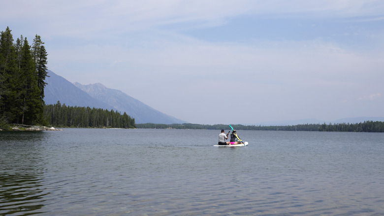 People float on Leigh Lake in the summer in Grand Teton National Park, Wyoming