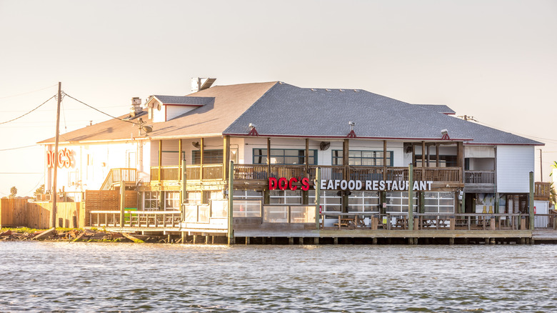 Exterior of waterfront Doc's Seafood Restaurant at dusk