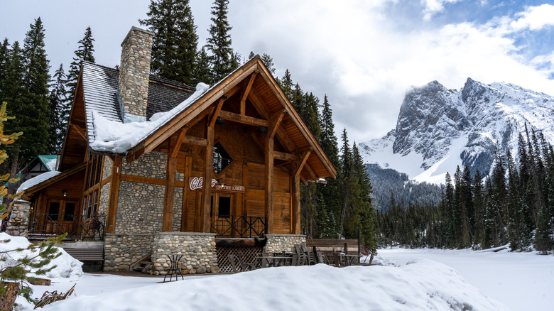 Stone and wood cabin in the snowy mountains