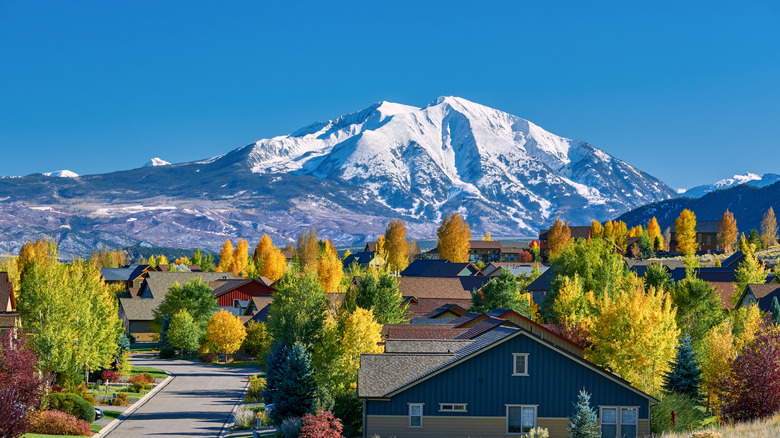 Mountain village with snowy peak in the distance