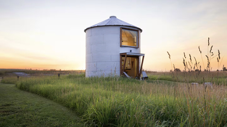 Metal silo in a field at twilight