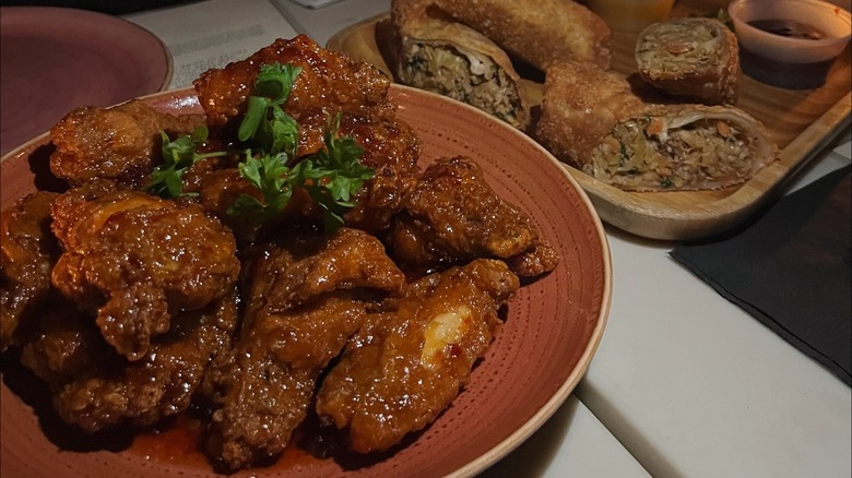 Chicken wings and spring rolls at Las' Lap