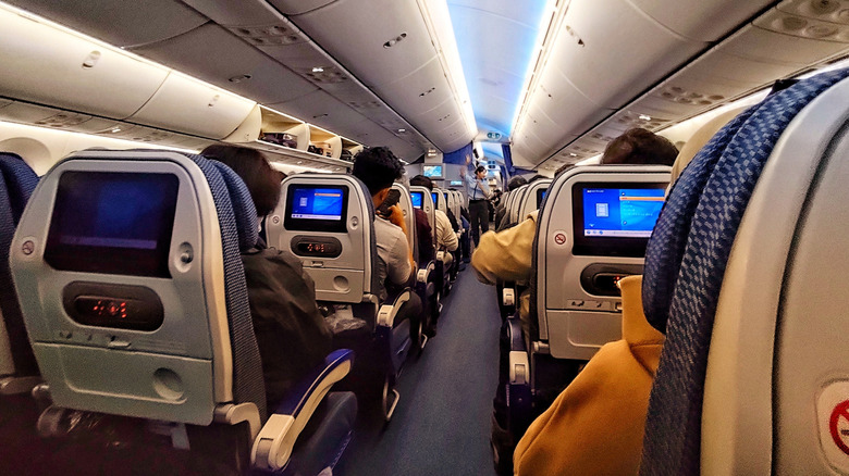 Passengers seated comfortably on a flight to Tokyo
