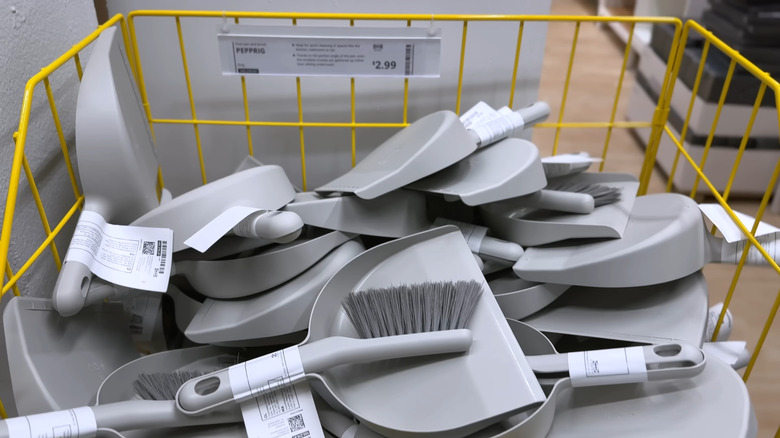 Bin of Pepprig dustpans and brushes at IKEA
