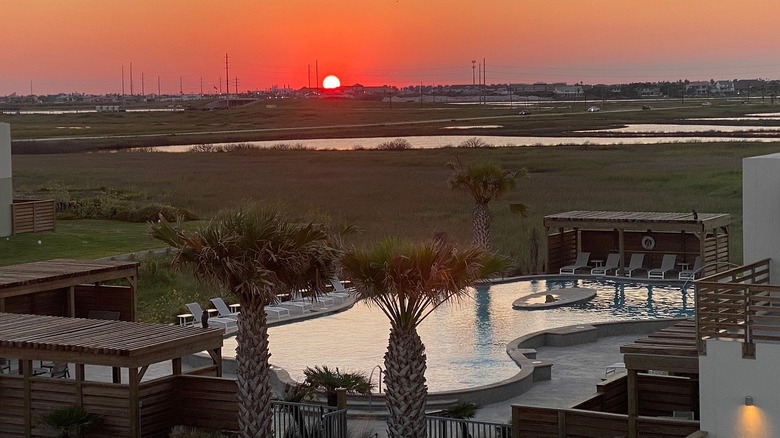 sunset over lively beach resort in corpus christi