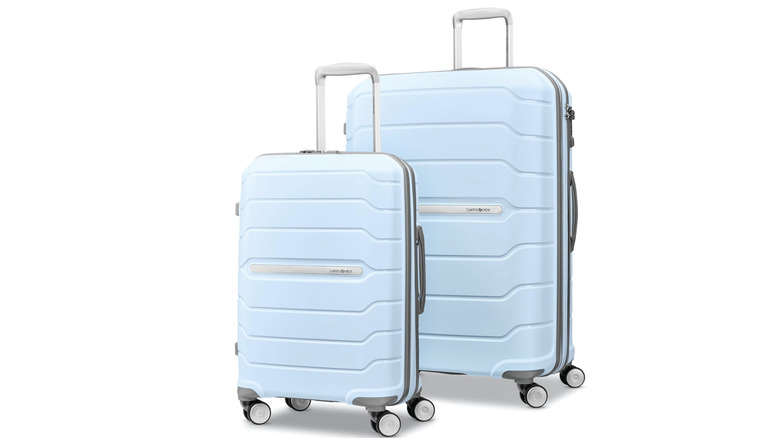 Two sky-blue Samsonite suitcases