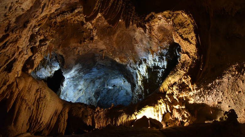 A dynamically lit tunnel in Lake Shasta Caverns
