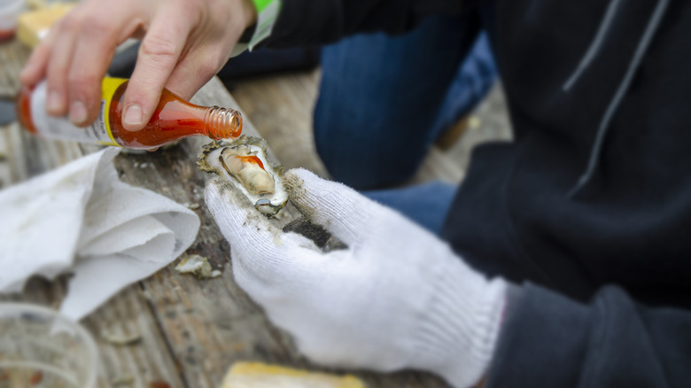Low country oysters served with hot sauce