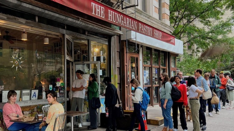 Guest crowd lively storefront of The Hungarian Pastry Shop