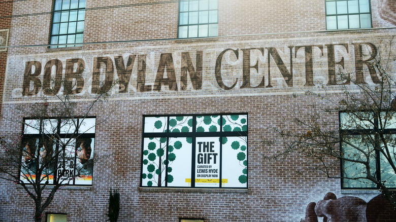 A brick building with a sign reading Bob Dylan Center