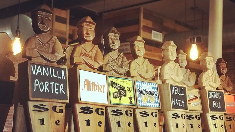 Line of wooden taps at Stubborn German Brewing Company