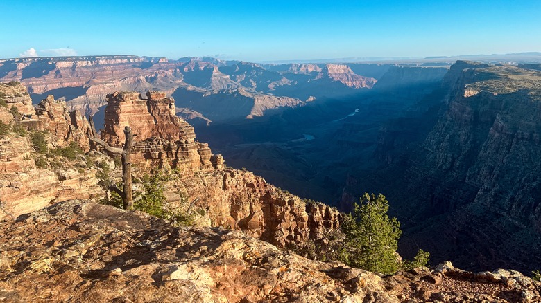 Sunrise at Desert View Campground: deep indigo skies glow softly behind the Grand Canyon's rugged rim at dawn