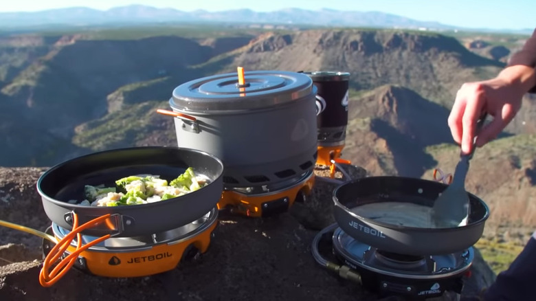 Camp stove being used overlooking a canyon