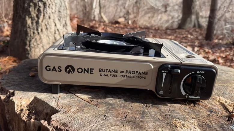 One burner camping stove outside