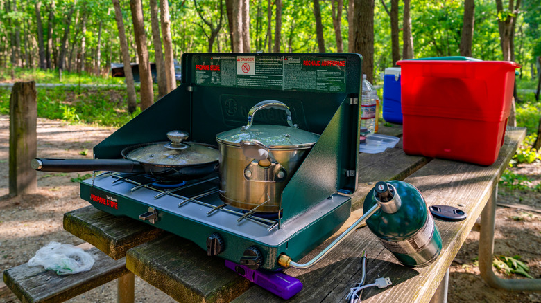 camp stove on picnic table at campsite