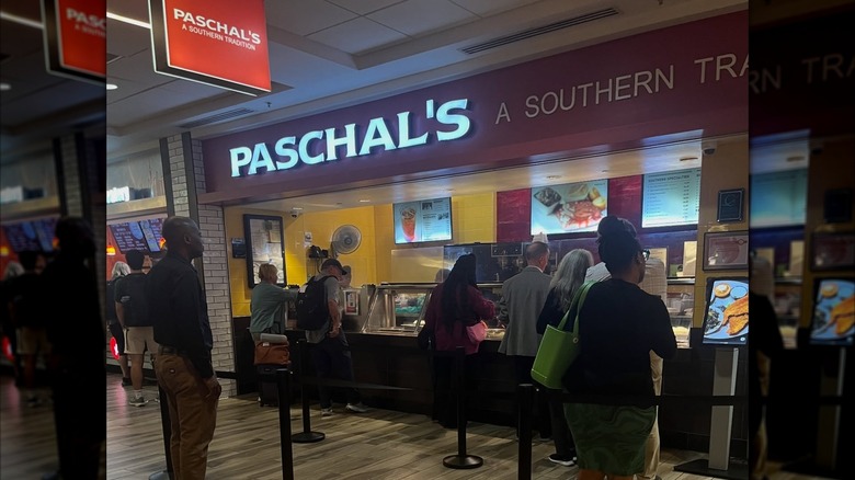 People waiting outside Paschal's at the airport