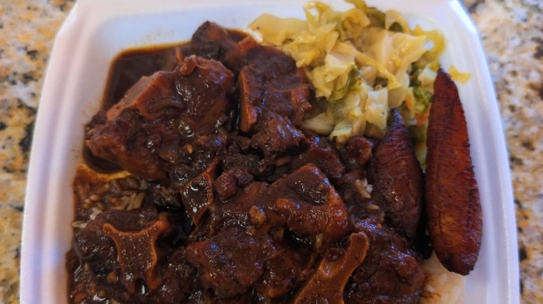 An overhead view of braised oxtail from Golden Krust
