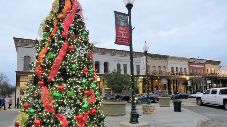 The downtown area of Granbury with a Christmas tree in front