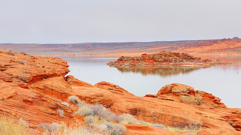 Red rock formations and calm water at Sand Hollow State Park
