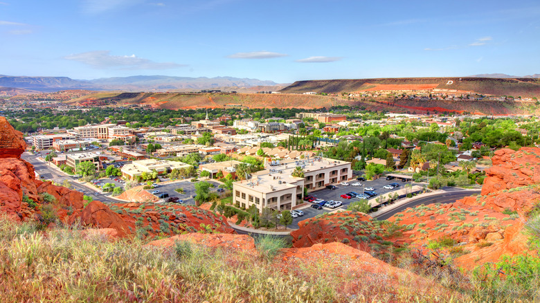 Scenic view of St. George, Utah with red rock hills and city buildings