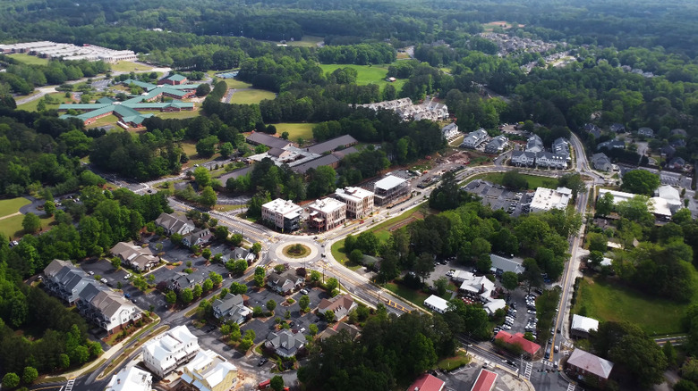 Aerial view of Milton, Georgia suburb, a landscape covered in greenery and buildings
