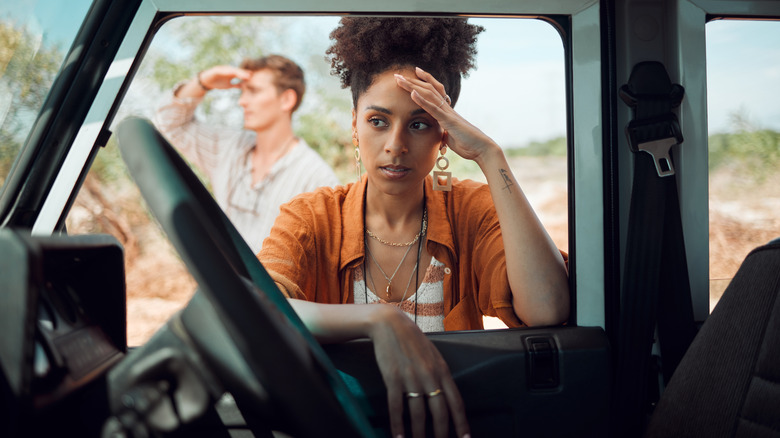 Couple waiting for assistance on the road