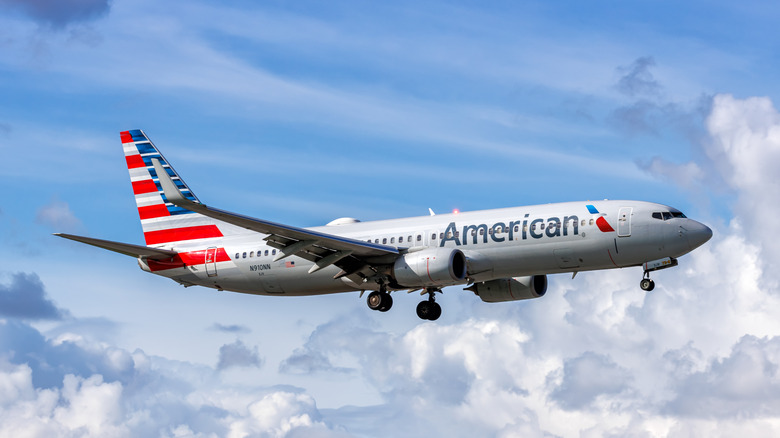 An American Airlines flight mid-air over Miami International Airport