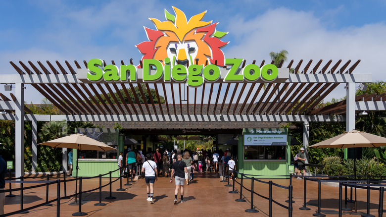 People walking through the entrance to the San Diego Zoo