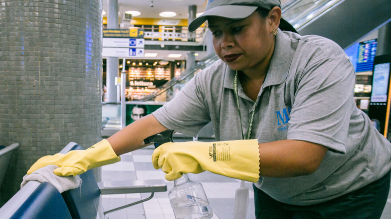 Woman cleaning in an airport