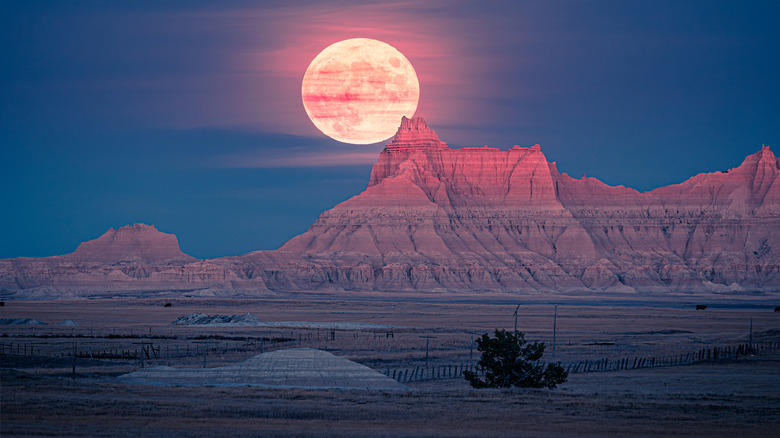 Moon out at night in Badlands National Park