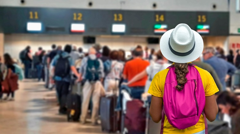Travelers waiting in line at the airport