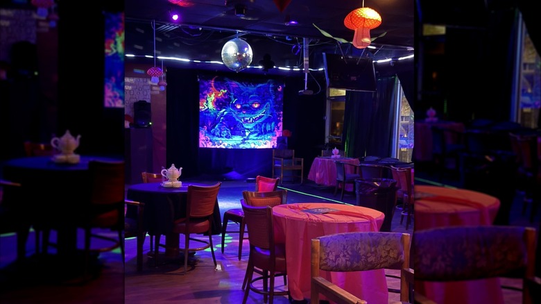 The interiors of St George, Myrtle Beach, with a disco ball and artwork of a cat on stage