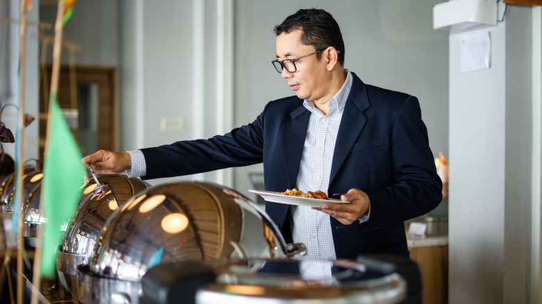 Someone getting breakfast in a hotel