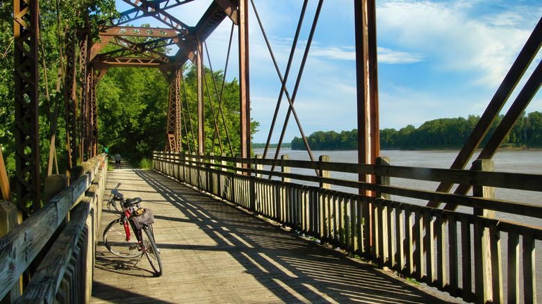 A bicycle is parked on a trestle bridge on the Katy Trail in Missouri