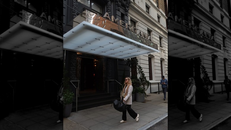 A woman walking in front of the Ameritania front entrance