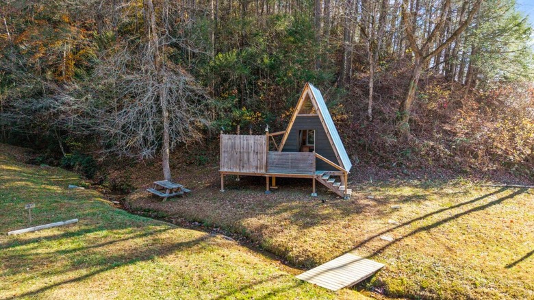 A cabin in the woods by a creek