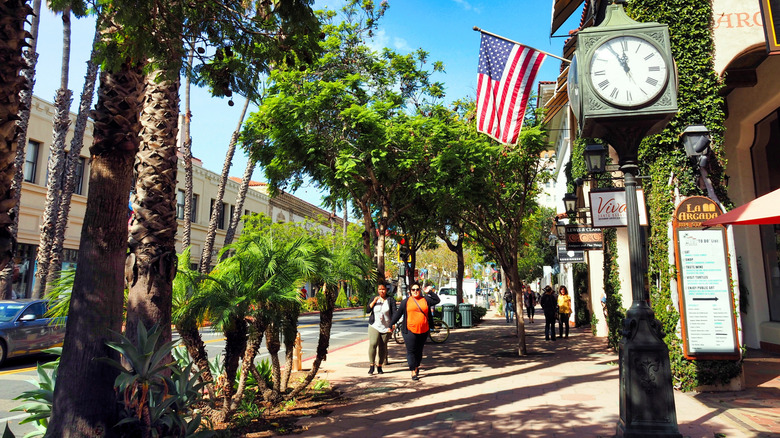 People walking down State Street, the main street in the downtown of Santa Barbara