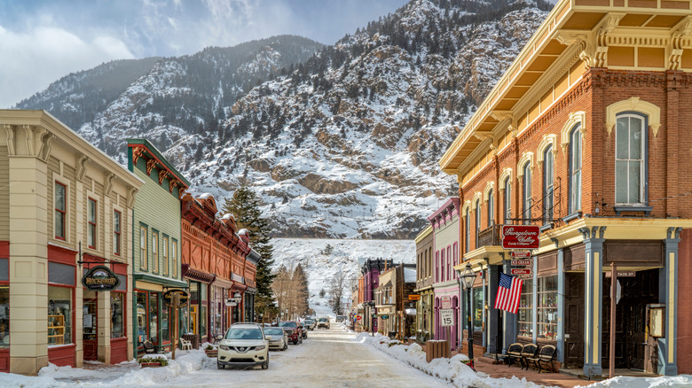 The historic center of Georgetown, CO, with snow on the mountains behind