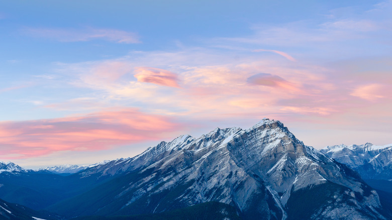 Icy mountains and a hazy pink and blue sky